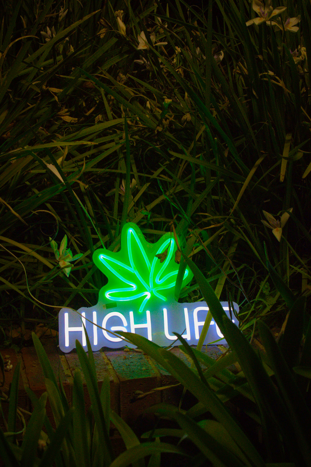 Vibrant Neon Leaf Sign